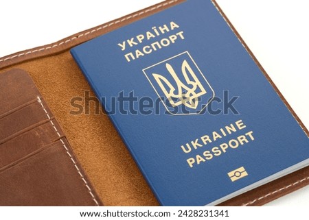 Handmade products made of genuine brown leather. Leather passport cover, leather wallet. Leather passport cover isolated on white background. Craft, handmade. 