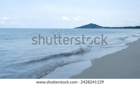 View Of Penganak Beach With A Small Mountain In The Background, In Jebus, Indonesia