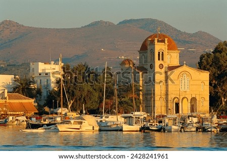 Town church and waterfront, aegina, argo-saronic islands, greece, europe Royalty-Free Stock Photo #2428241961