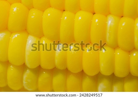 Yellow boiled corn dipped in salt water