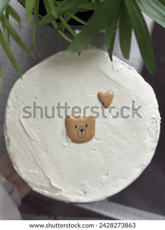 Cute cake for birthday. A bento white cake with a teddy bear