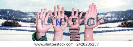 Children Hands Building Colorful German Word Info Means Information. White Winter Background With Snowflakes And Snowy Landscape.