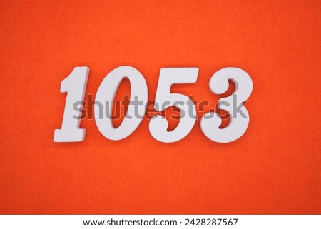 Orange felt is the background. The numbers 1053 are made from white painted wood.