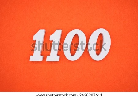 Orange felt is the background. The numbers 1100 are made from white painted wood.