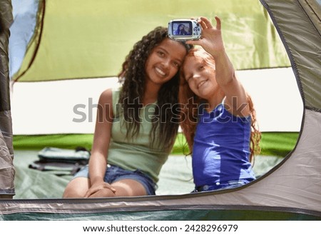 Happy girl, friends and selfie in tent for memory, camping or photography together with camera. Young female person, child or kids with smile for picture, photo or social media in relax or friendship