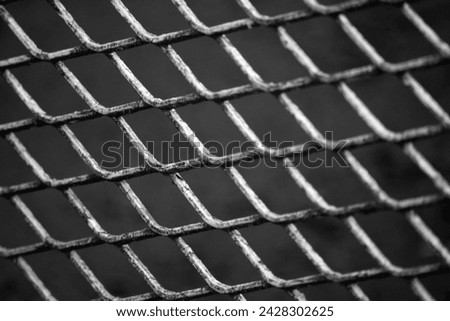 Perspective view of a chainlink fence Royalty-Free Stock Photo #2428302625