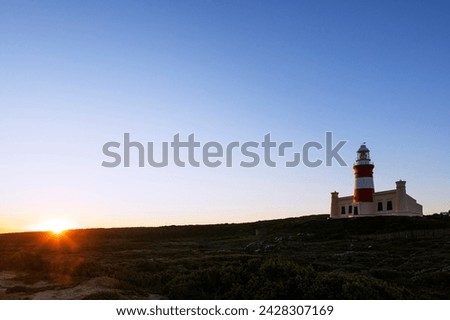 Agulhas lighthouse at southernmost tip of africa at sunset, agulhas national park, western cape, south africa, africa