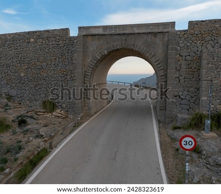 the underpass of the famous Nus de Sa Corbata hairpin turn on the Serra de Tramuntana highway in the mountains of northern Mallorca Royalty-Free Stock Photo #2428323619