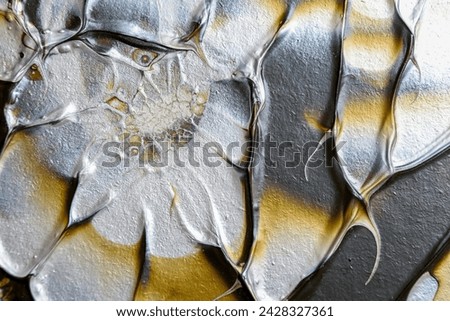 Abstract gradient background of silver, gold and brown colors.