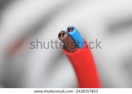 Colorful electrical wire on blurred background, closeup. Space for text
