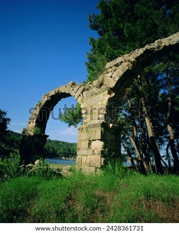 Roman aqueduct at phaselis, ancient ruins on the mediterranean, turkey, eurasia