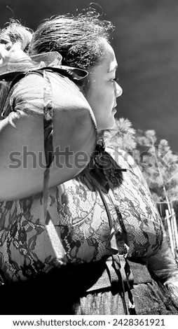 Black And White Portrait Of A Girl In A Cute Laced Outfit With Hand Ruffles