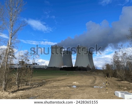 Temelin nuclear power plant cooling towers in the Czech Republic. Electricity generation from uranium according to Russian Rosatom technology combined with Western Westinghouse Siemens control system. Royalty-Free Stock Photo #2428365155