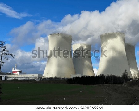 Temelin nuclear power plant cooling towers in the Czech Republic. Electricity generation from uranium according to Russian Rosatom technology combined with Western Westinghouse Siemens control system. Royalty-Free Stock Photo #2428365261