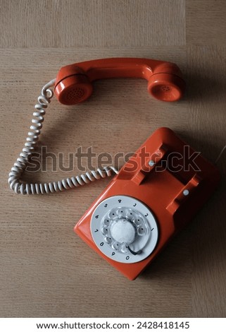 old retro handset phone orange color ring dial nostalgic design