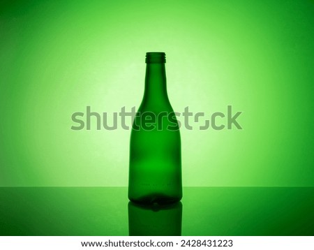 A captivating image of assorted glassware illuminated by colored gel filters in a creative backlight setting, creating an artistic and vibrant visual display. Royalty-Free Stock Photo #2428431223