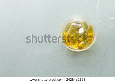 supplement, daily dose of vitamins, a box for vitamins to go Royalty-Free Stock Photo #2428462163