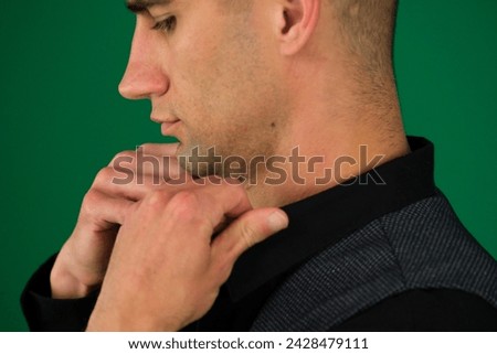 close-up of a man's hands straightening a black shirt, he gives vest of a classic suit, shoulders from different sides, set Three photos on a green background chromakey close-up dark hair young man