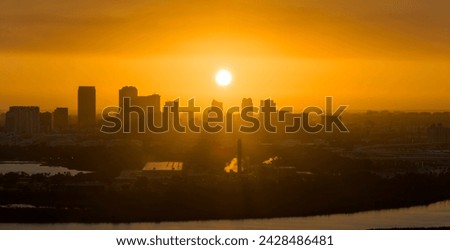 View from above of contemporary high skyscraper buildings in downtown district of Tampa city in Florida, USA at sunset. American megapolis with business financial district.