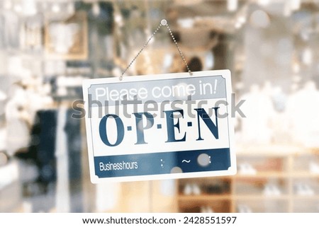 Open sign with abstract product background.
