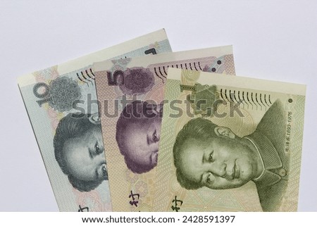 Isolated background close-up of Chinese Yuan's banknotes showing Mao Zedong's portrait 