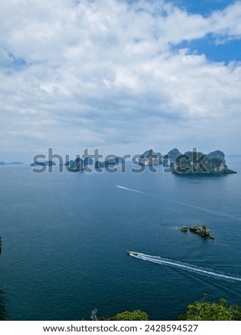 Hong Island 360 viewpoint view on many small islands around. Panoramic photography with view on sailboat (tail boat) in the sea)