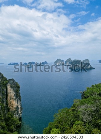 Hong Island 360 viewpoint view on many small islands around. Panoramic photography with cliffs and forest.