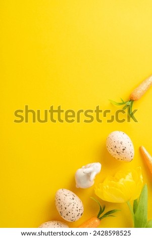 Springtime Easter charm. Top view vertical picture of eggs, carrots for the bunny, and tulip on a lively yellow canvas with space for text or advertising