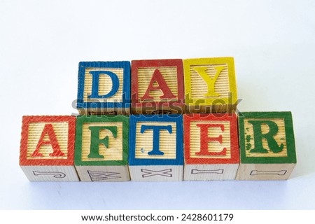 The term day after visually displayed on a clear background with copy space in horizontal format Royalty-Free Stock Photo #2428601179