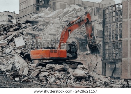 construction equipment destroys affected houses war in Ukraine with Russia Royalty-Free Stock Photo #2428621157
