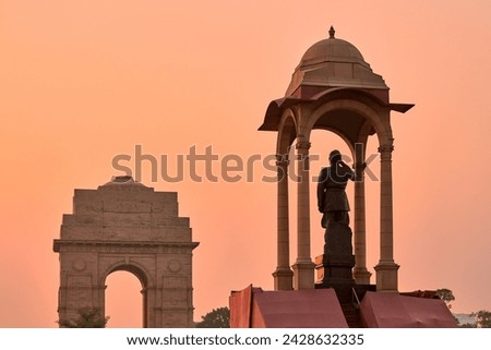 Statue of Subhas Chandra Bose under canopy behind India Gate war memorial, monolithic Netaji statue made of black granite in New Delhi immortalizes Indian freedom fighter of Indian National Army Royalty-Free Stock Photo #2428632335
