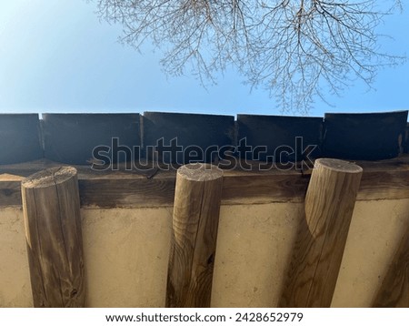 In Joseon royal tombs, there is a building for preparing ancestral rites called 'Jaesil,' characterized by its simple and colorless design. Here is a picture of the eaves of the Jaesil roof. Royalty-Free Stock Photo #2428652979