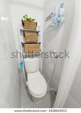 The toilet room is small with dimensions of 1 meter x 1 meter. Royalty-Free Stock Photo #2428665013