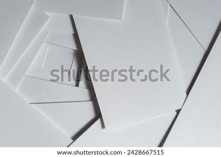 Background of overlapping white cards Royalty-Free Stock Photo #2428667515