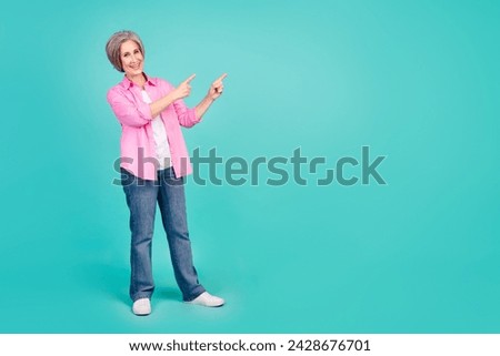 Full body photo of elderly expert business woman indicate fingers empty space useful tips for startupers isolated on blue color background