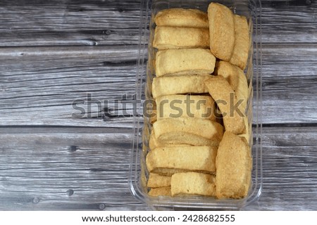 Plain Menen bakery, oriental crackers and cookies, usually baked plain or stuffed with tamr, Ajwa or dates, Arabic Egyptian oriental cuisine of cookies, consumed as a snack with a drink like tea Royalty-Free Stock Photo #2428682555