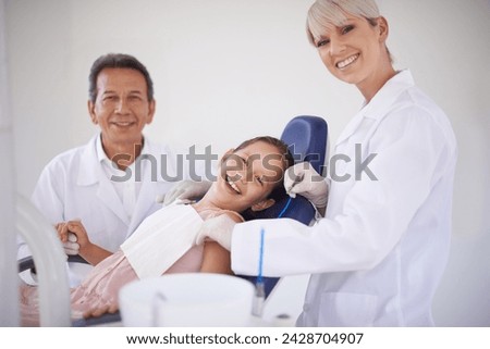 Portrait, dentist and technician with child in clinic for expert advice, orthodontics and medical health. Dental medicine, healthcare and professional man with girl, woman and oral service in office