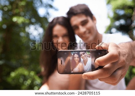 Couple, selfie and phone screen for hiking in forest with smile for memory, post and web blog. Man, woman and profile picture for trekking, direction and jungle on app for social media in Colombia