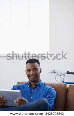 Man, tablet and relax in portrait at home, subscribe and internet for web or blog. Black male person, smile and streaming entertainment on couch, mockup space and app for online shopping on weekend