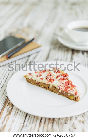 Cranberry cake and coffee cup on wooden background - film effect style pictures