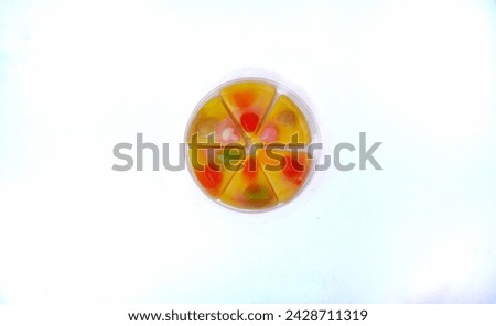 close up of pizza shaped jelly candy isolated on white background