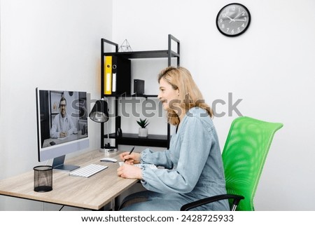 Caucasian doctor video conference call online live talk follow up remotely in medical result with woman sitting at chair at home. Online health care digital service concept Royalty-Free Stock Photo #2428725933