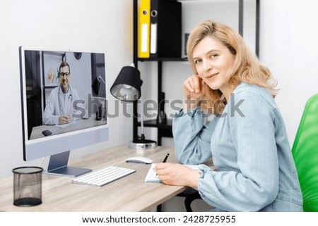 Caucasian doctor video conference call online live talk follow up remotely in medical result with woman sitting at chair at home. Online health care digital service concept Royalty-Free Stock Photo #2428725955