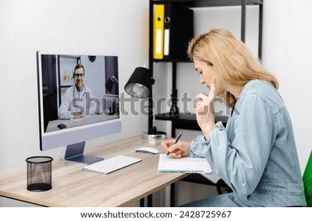 Caucasian doctor video conference call online live talk follow up remotely in medical result with woman sitting at chair at home. Online health care digital service concept Royalty-Free Stock Photo #2428725967
