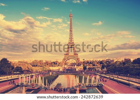 Eiffel Tower and fountain at Jardins du Trocadero at sunset in Paris, France. Travel background