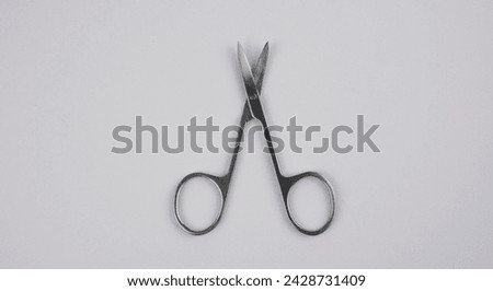 Nose hair scissors on the white background.