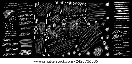 Set of white vector grunge elements on black background. Grungy hand drawn scribbles, pen hatches, strokes, scrawls, dots and knots. Punk style creative contemporary collage overlay isolated elements