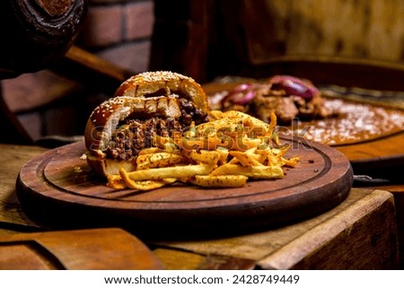 meat burger french fries spices side view