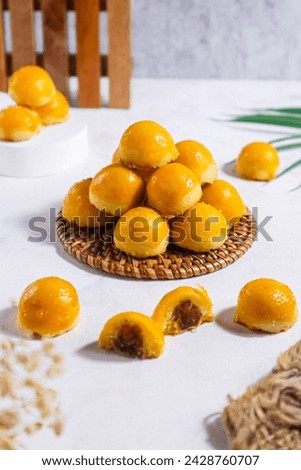 Nastar cookies are neatly stacked and shiny, filled with lots of pineapple jam Royalty-Free Stock Photo #2428760707