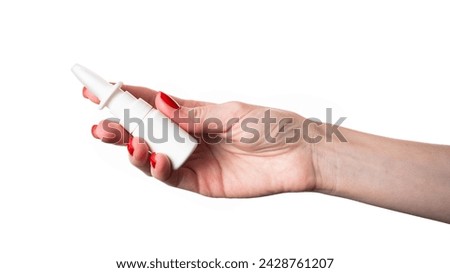 Female hand holding nasal spray on white background. Nasal spray isolated. High quality photo